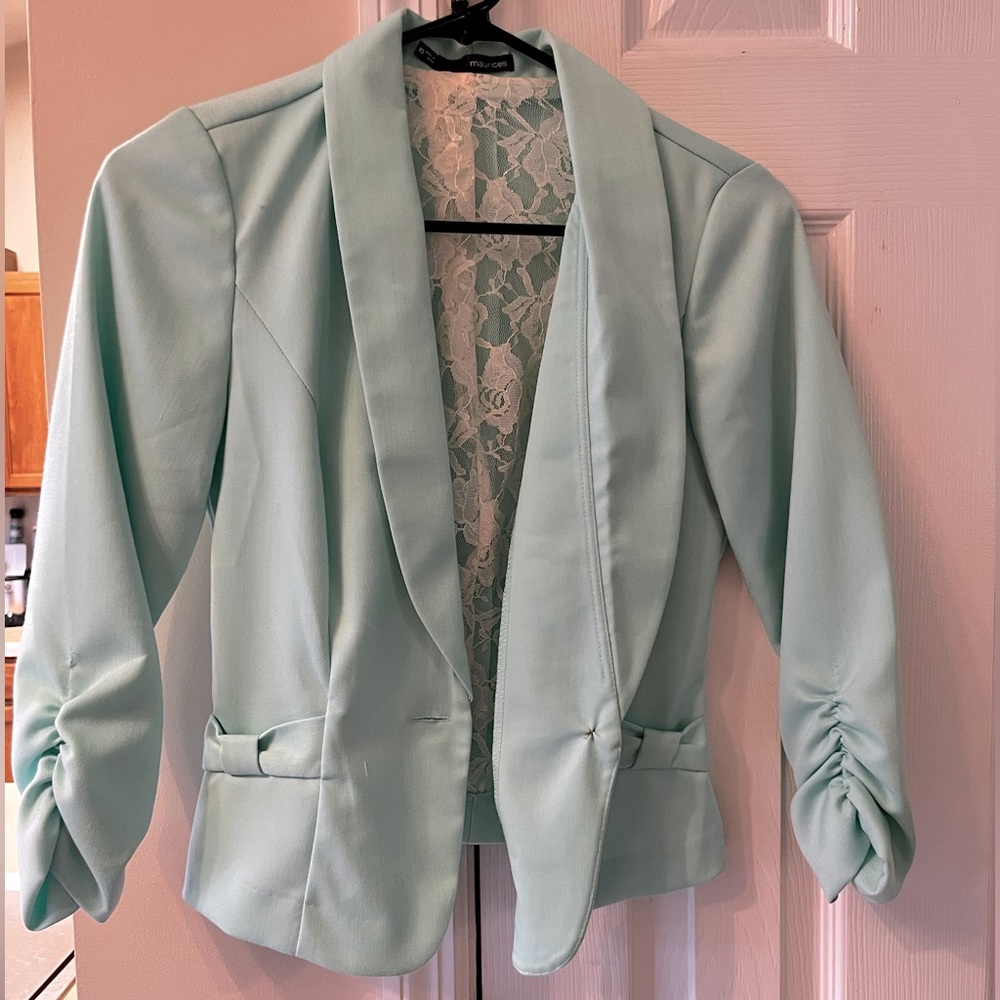 Blazer with 3/4 length sleeves and length is above hips